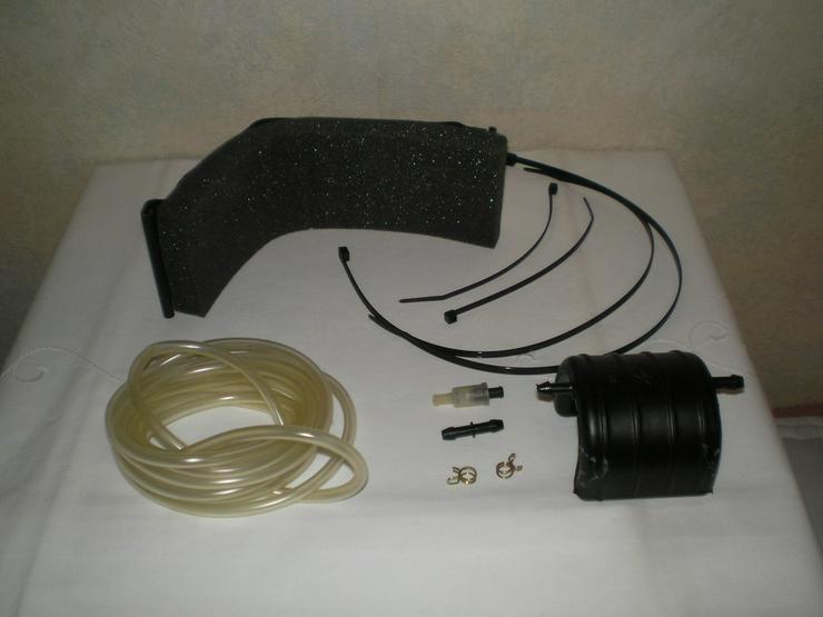 Bild 3: Handlampe, Radschlüssel, Warmwasser, Ladegerät