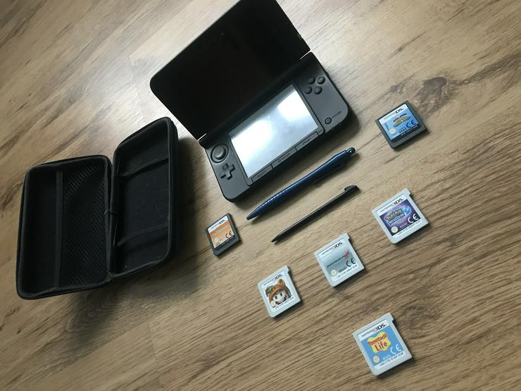 Bild 1: Nintendo 3DS XL mit Zubehör und sechs Spielen