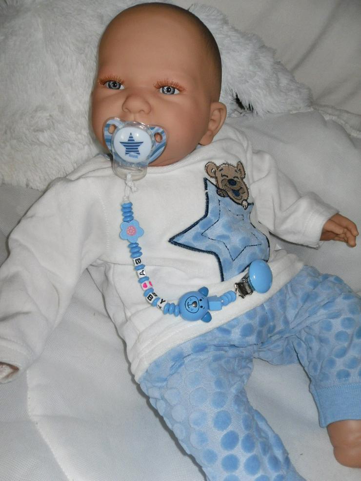 Bild 8:  Babypuppen Noah 54 cm mit Schnuller und Schnullerkette Doro Baby 