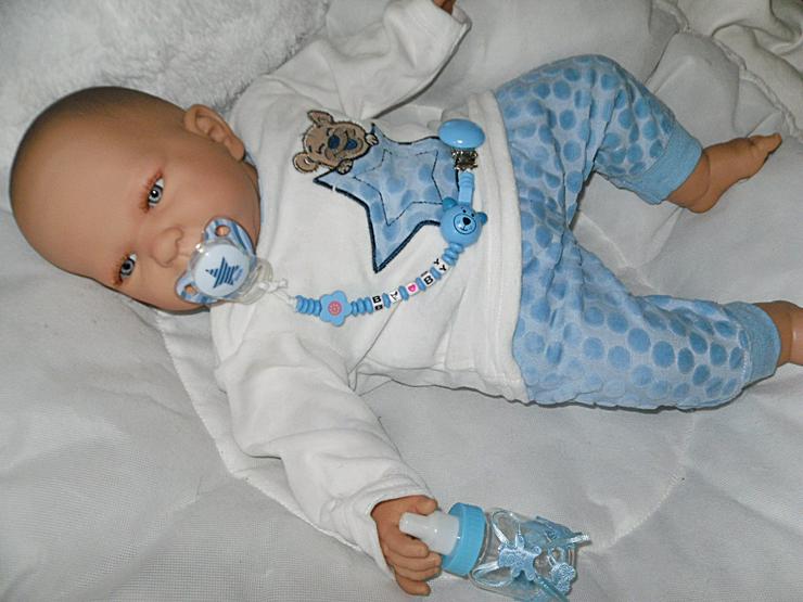 Bild 9:  Babypuppen Noah 54 cm mit Schnuller und Schnullerkette Doro Baby 