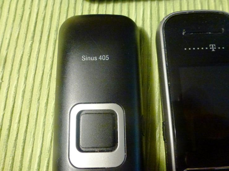 Bild 2: 4 Mobilteile und 3 Ladeschalen SINUS 405 Opt. Akkus
