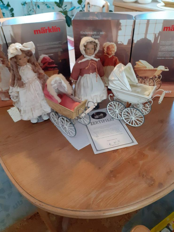Bild 7: Märklin Puppen mit/ohne Zertifikat sowie Puppenwagen