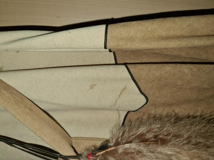 Bild 2: Auflösung von Markenware verschiedener Damenbekleidungen und Markenware 1 Herrenanzug