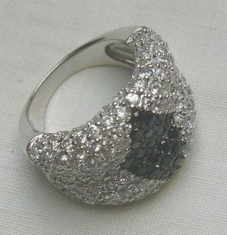 Bild 6: Ring 925 Silber mit gefassten Weistopasen und dem Onyx