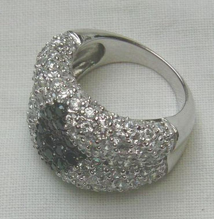 Bild 4: Ring 925 Silber mit gefassten Weistopasen und dem Onyx