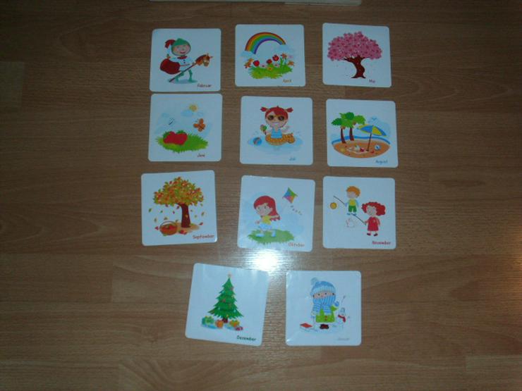 Bild 5: Lerntafel von MyToys, Holz für Uhrzeit, Datum Monate usw.